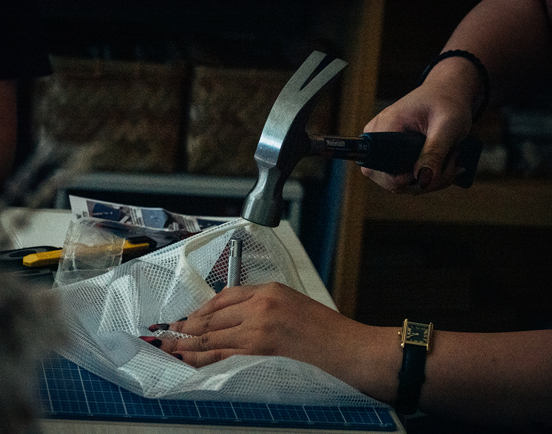 Punching sewing stations along the spine with an awl